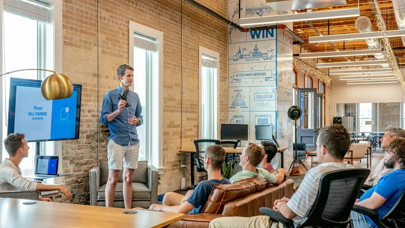 A business team seated around a meeting table