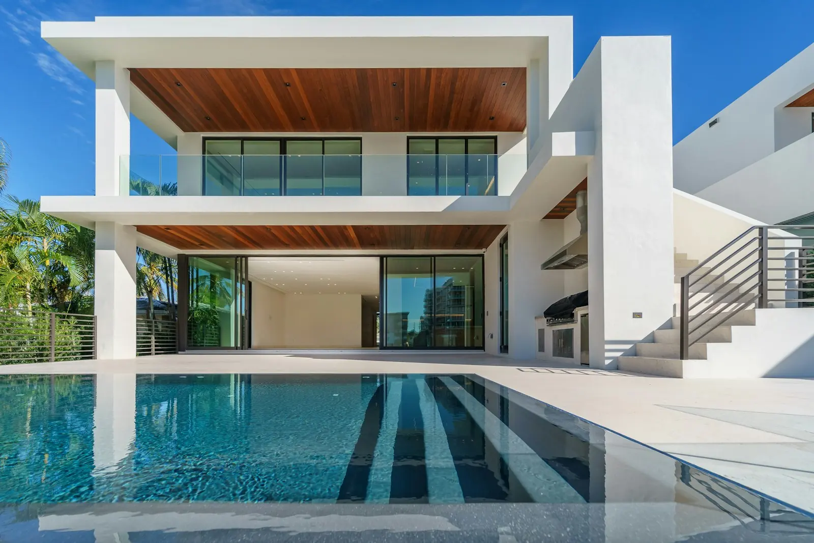 A modern house and pool photographed from the terrace