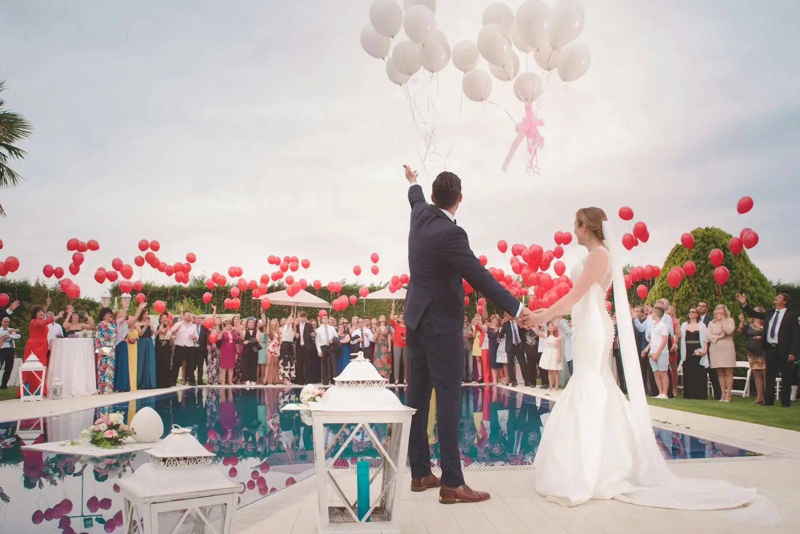 A couple photographed outdoors in wedding clothes
